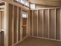 12x16 Custom Studio Style Storage Shed With Hemlock Porch and Workbench inside