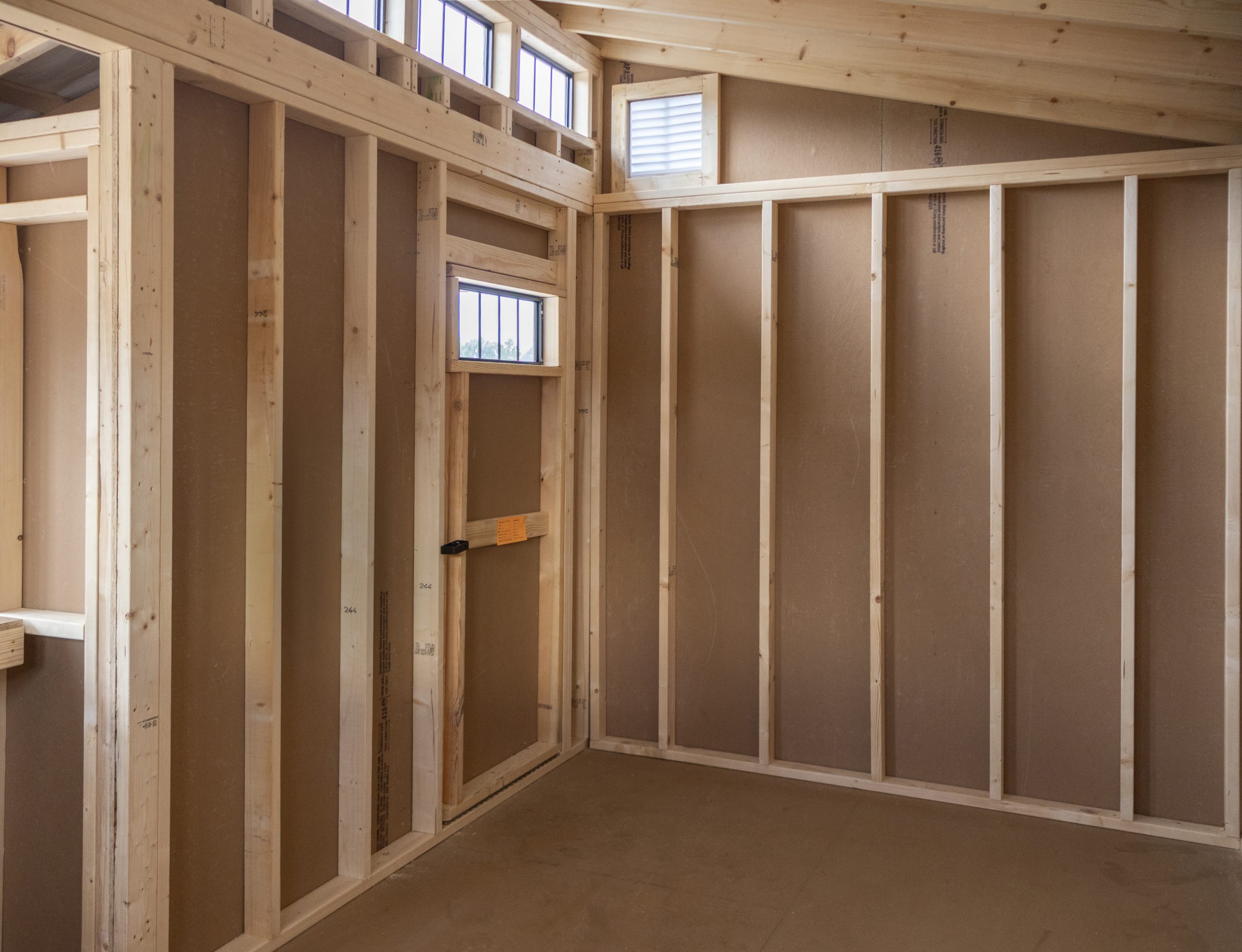 12x16 Custom Studio Style Storage Shed With Hemlock Porch and Workbench inside