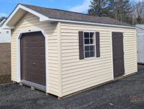 10x16 Peak Front Sunny Maize Straight Lap Vinyl Siding White Trim Dark Brown Shutters and Rustic Slate Shingles