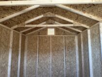 Interior view of shed showing 25-year PerformMax flooring and gable vents.