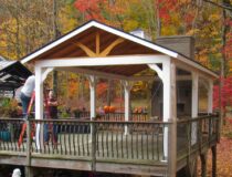 Custom Amish built 12x24 peak pavilion with a traditional A frame timber roof in a backyard setting.