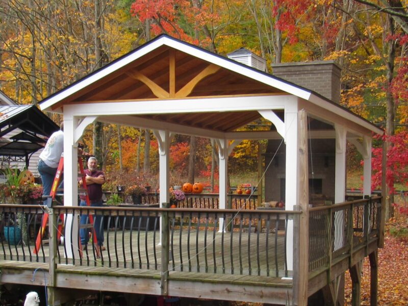 Custom Amish built 12x24 peak pavilion with a traditional A frame timber roof in a backyard setting.