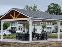 Amish crafted 16x16 peak pavilion with white vinyl frame and shadow grey shingles