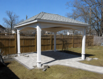Detailed close-up of the elegant arched headers on a white vinyl pavilion.