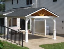 12x14 Peak Pavilion in white vinyl with black shingle roof on display