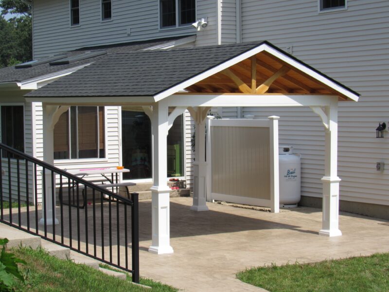 12x14 Peak Pavilion in white vinyl with black shingle roof on display