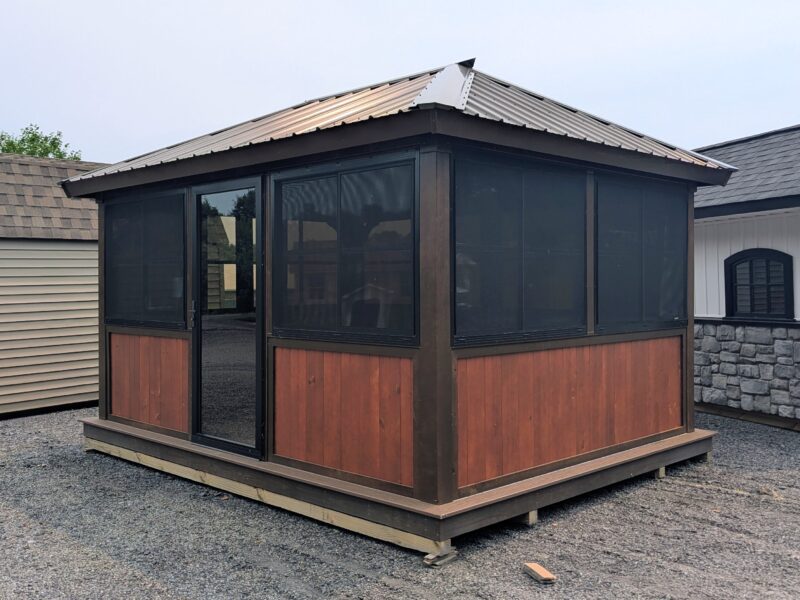 12x14 three season screened cabana with cedar-tone panels, aluminum roof, and sliding screen door