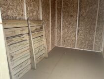Interior framing and 25 Year PerformMax Floor of a 6x10 Madison Peak shed
