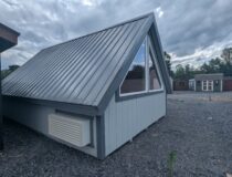 12x20 A-frame cabin with metal roof, triangular windows, and mini split system