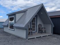 12x20 A-frame cabin with covered porch, metal roof, picture window, and glass door