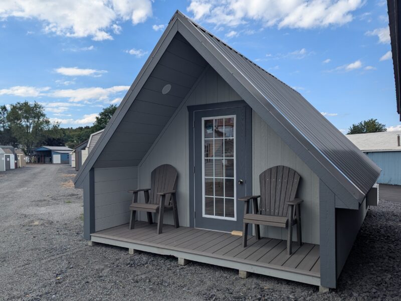 Front view of 12x20 A-frame cabin with covered porch and full-view entry door