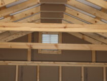 12x24 Peak Garage with Coffee Polyuretane siding, Beige trim and shutters, and Burnished Slate metal roof