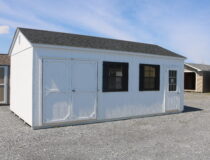 12x22 HD Peak with White siding, White trim, Black shutters, and Rustic Black shingles
