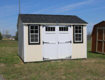 10x12 HD Peak with Navajo White siding, White trim, Black shutters, and Rustic Black shingles
