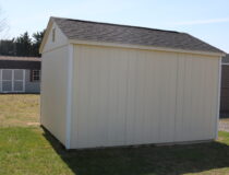 10x12 HD Peak with Navajo White siding, White trim, Black shutters, and Rustic Black shingles