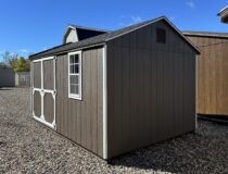 Front view of the 10x14 Madison Peak storage shed featuring bronze siding and white trim at Pine Creek Structures in Berlin, CT