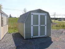 8×12 Mini Barn Cut Lap with PC Green siding, White trim, and Fox Hollow Gray shingles