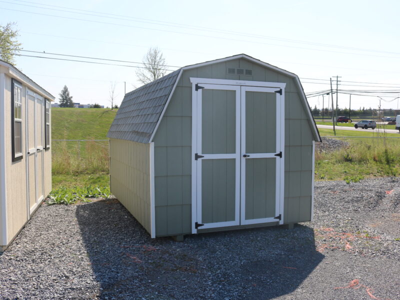 8×12 Mini Barn Cut Lap with PC Green siding, White trim, and Fox Hollow Gray shingles