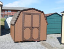 8x10 Madison Mini Barn with Chestnut siding, Dark Brown trim, and Rustic Slate shingles
