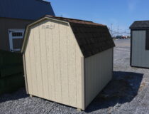 6x8 Madison Mini Barn with Beige siding, PC Clay trim, and Rustic Cedar shingles