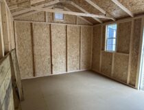 Interior view of the 10x14 Madison Peak shed highlighting the 2x3 framing and PerformMax flooring.