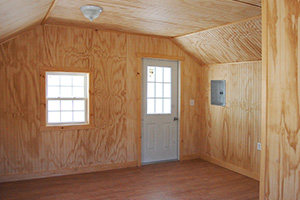 Custom Home Office Building from Pine Creek Structures | Finished Shed Interior with unpainted beadboard walls and ceiling, electrical package, and custom upgrades