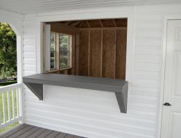 Custom Hip Style Shed with Concession Window and Porch