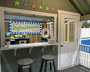 Cape Cod Style Poolside Snack Shed with bar window built by Pine Creek Structures