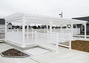 vinyl bedford pergola with Railing and ramp from Pine Creek Structures
