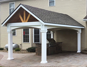 vinyl peak pavilion with arched headers, dentine trim, and 8-pitch roof from Pine Creek Structures