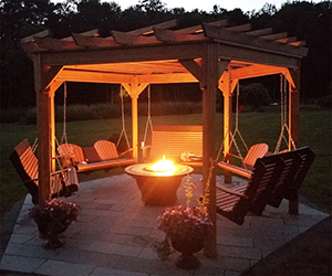 wooden Swingola with firepit in center from Pine Creek Structures