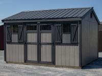 10x14 Peak Storage Shed with New England Package (wide trim, transom windows, etc), driftwood grey LP siding, black trim, and black metal roofing