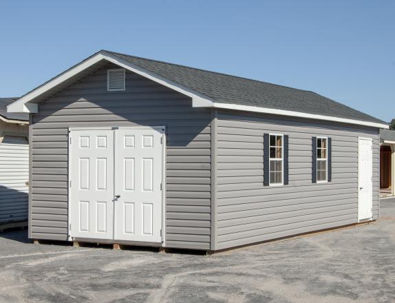 12x28 Front Entry Peak Storage Shed with Vinyl Siding and Roof Overhangs