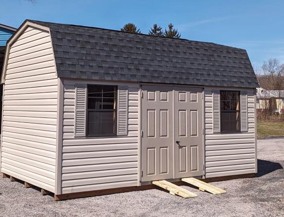 10x16 Dutch Barn Storage Shed. In Warm Sandalwood Vinyl Siding with clay trim, doors, and shutters