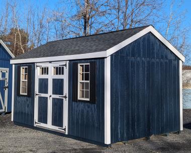 Midnight blue 10x16 A-Frame shed with white trim and black shutters