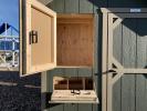 Nesting boxes and storage on a Coop by Pine Creek Structures