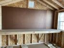 Workbench and pegboard on a 10x12 shed by Pine Creek Structures of Berlin